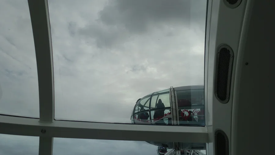 An observation wheel capsule seen through another capsule’s window.